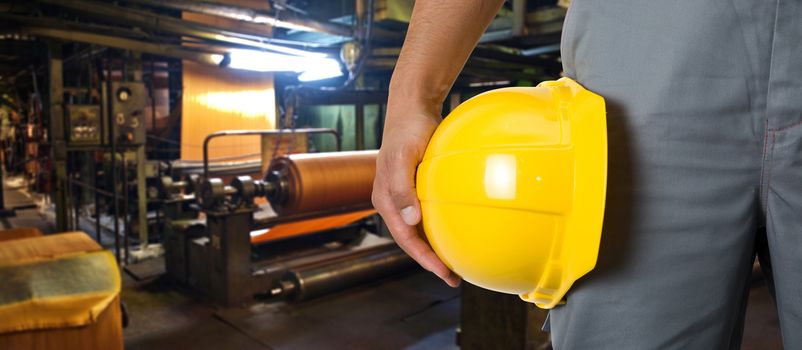 Worker with safety helmet at industrial factory