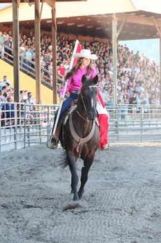 MERRITT, B.C. CANADA - May 30, 2015: Opening ceremony horse rider at The 3nd Annual Ty Pozzobon Invitational PBR Event.