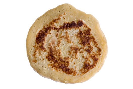 Single Pancake well cooked with various shades of the brown color areas but not burnt, above view isolated on white background