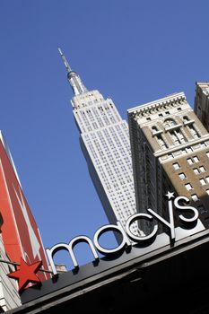 Macy's department store in the foreground with the Empire State Building in the background in mid-town Manhattan, New York City, New York, USA