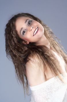 Beautiful Woman with Brown Curly Hair Smiling