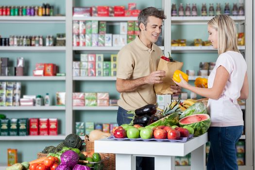 Couple shopping a vegetables