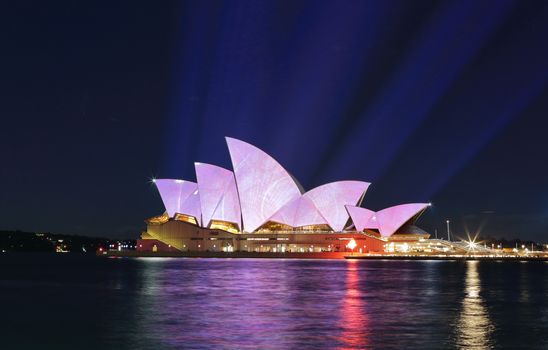 SYDNEY, AUSTRALIA - JUNE 2, 2015; Light beams project soft pastel colours and patterns onto Australia's iconic landmark, Sydney Opera House for Vivid Sydney.