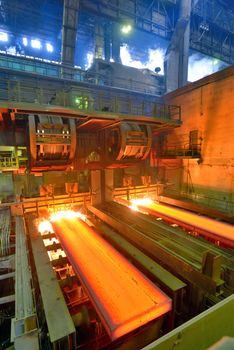 hot steel on conveyor inside of steel plant