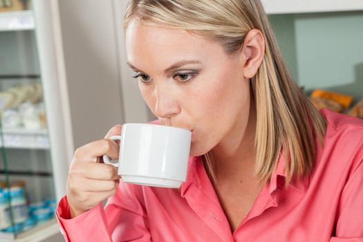 woman drinking a coffee