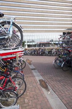 many bicycles in front the hague central station in holland