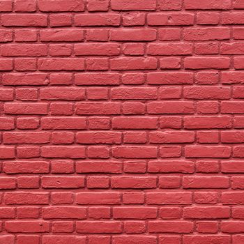 square part of red painted brick wall