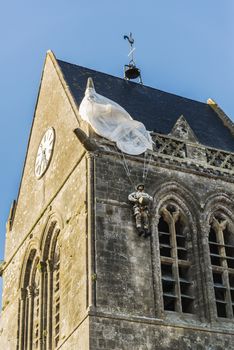 the famous church with the manequin of solder on the tower bell in St Mere Eglise in Normandy