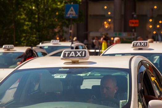 MILAN, ITALY - MAY, 15: Taxi parking in Milan on May 15, 2015
