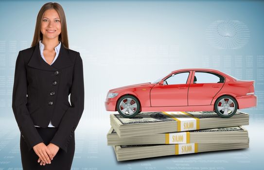 Businesslady with red car standing on bundle of money on abstract blue background