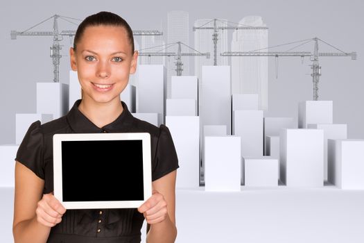 Smiling young woman holding tablet and looking at camera on abstract background with building crane