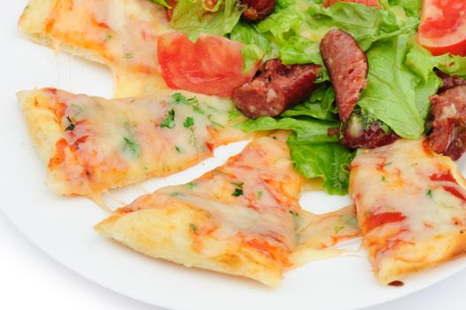 Pizza slices with melted cheese and fresh vegetable salad