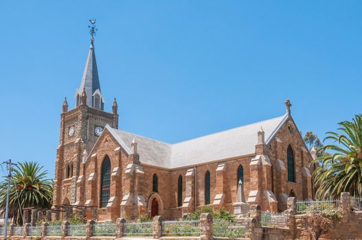 UNIONDALE, SOUTH AFRICA - JANUARY 6, 2015: The Dutch Reformed Church was built in 1886. The tower has only three clock faces as the one side  faces the mountain
