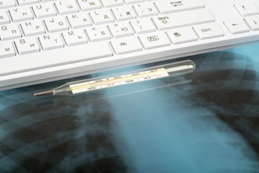 X-ray examination and keyboard with thermometer, pen