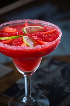 Strawberry margarita cocktail on the bar. Shallow dof