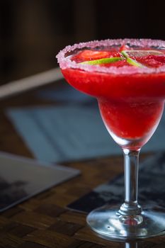 Strawberry margarita cocktail on the bar. Shallow dof