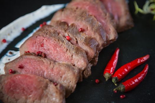 Medium Rare Cooked Beef Roast with Vegetables and Spices
