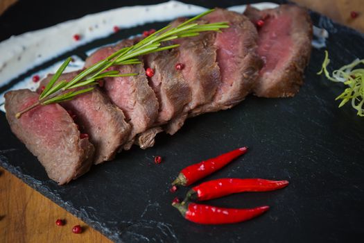 Medium Rare Cooked Beef Roast with Vegetables and Spices