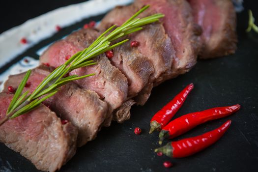 Medium Rare Cooked Beef Roast with Vegetables and Spices
