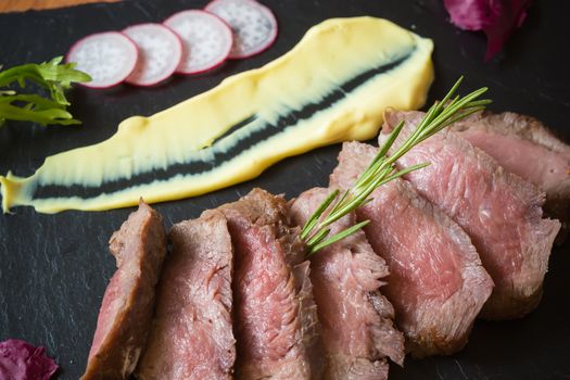 Medium Rare Cooked Beef Roast with Vegetables and Spices