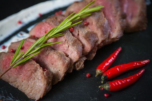 Medium Rare Cooked Beef Roast with Vegetables and Spices