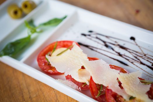 Fresh tomatoes, basil, garlic and parmesan cheese. Shallow dof