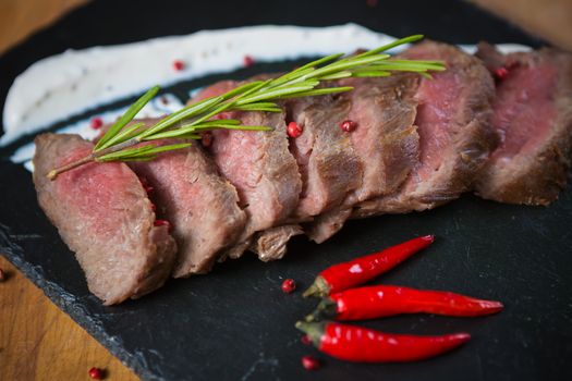 Medium Rare Cooked Beef Roast with Vegetables and Spices
