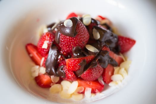 fresh strawberries dipped in dark chocolate. Shallow dof