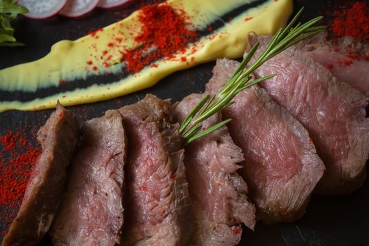 Medium Rare Cooked Beef Roast with Vegetables and Spices