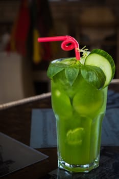 tropical green cocktail with lemon and fresh mint. Shallow dof