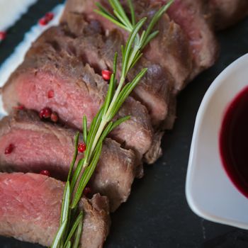 Medium Rare Cooked Beef Roast with Vegetables and Spices