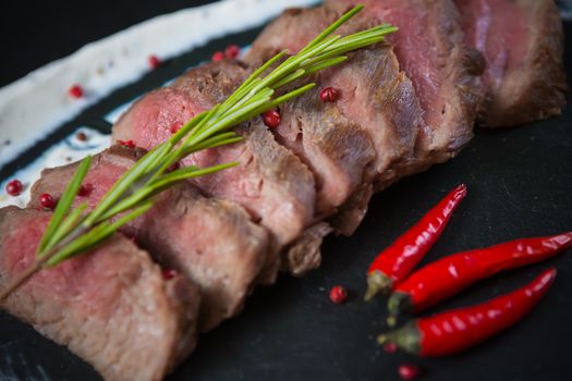 Medium Rare Cooked Beef Roast with Vegetables and Spices