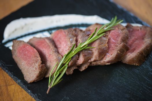 Medium Rare Cooked Beef Roast with Vegetables and Spices