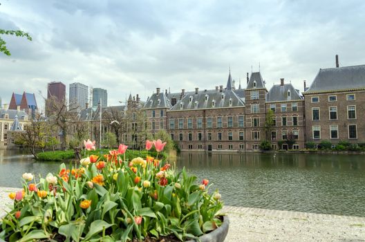 Dutch parliament buildings Binnenhof with skyscrapers in the background in The Hague, Netherlands.