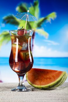 Summer drink with beach on background