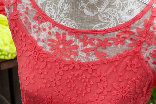 Closeup details of a woman fashionable classic red lace blouse shirt                               