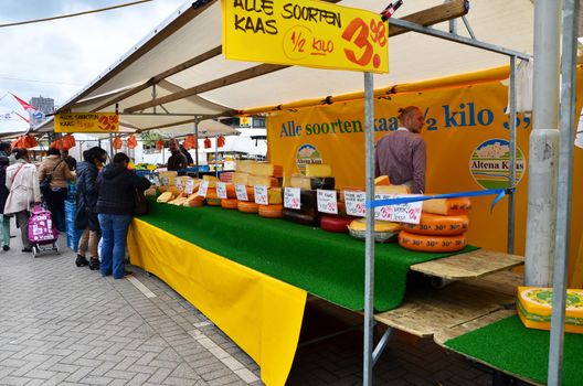 Rotterdam, Netherlands - May 9, 2015: Unidentified sellers and shoppers at the Street Market in Rotterdam. A large market is held in Binnenrotte, the biggest market square in the Netherlands.