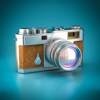 Vintage digital camera on a blue background