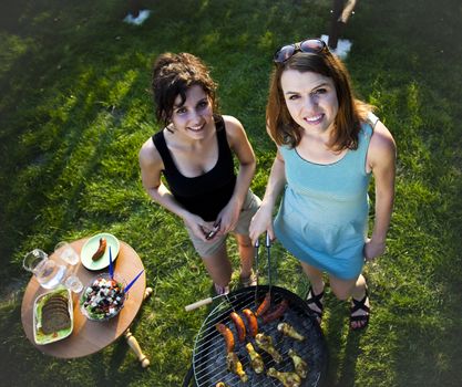 Two girls on grill, natural colorful tone