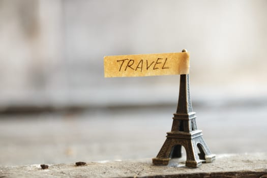 travel concept, Eiffel tower and  inscription "travel", place for text, soft focus