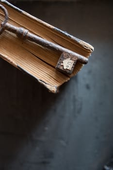 Key of house. Vintage key and old book and paper house.