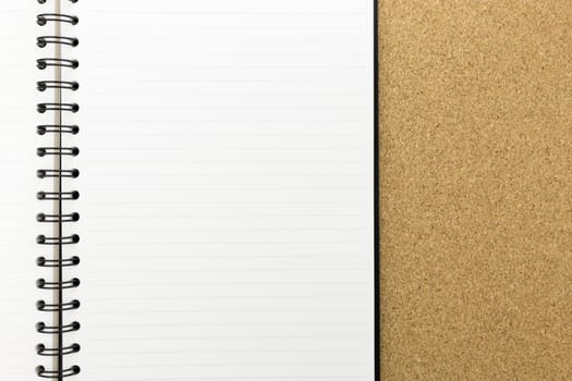 white notebook with line on cork board