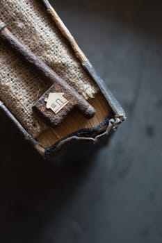 the key to the farm. Vintage key,  burlap and paper house.