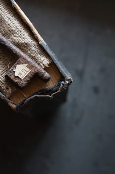 the key to the farm. Vintage key,  burlap and paper house.