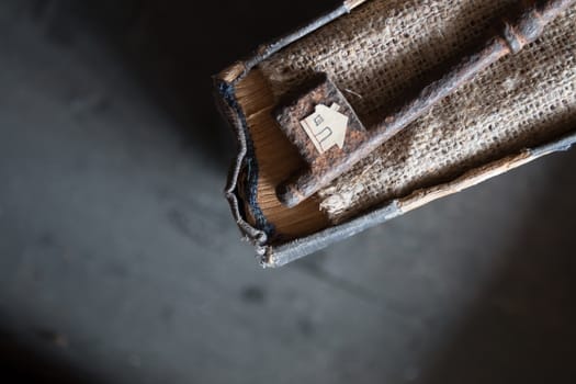 the key to the farm. Vintage key,  burlap and paper house.