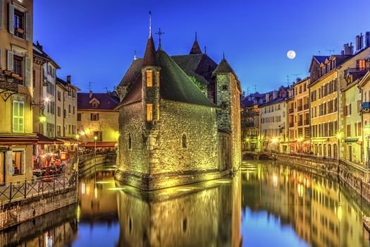 Palais de l'Ile jail and canal in Annecy old city by night, France, HDR