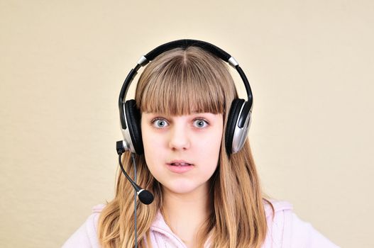 surprised teen girl with headphone on the head