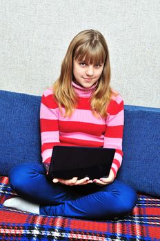 teen girl with notebook at the home