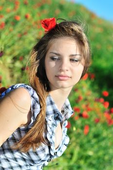 young sensual spring girl in the poppies field 