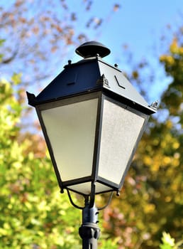 Old street lamp on a nature background